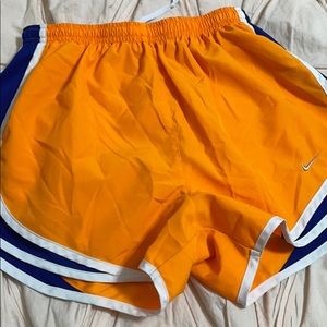 orange and blue nike shorts